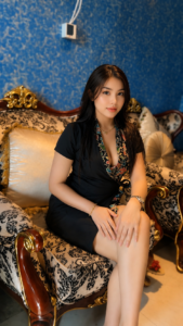 Woman seated on a plush gold sofa in Najma Signature Spa luxury lounge