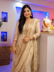 Elegantly dressed receptionist standing in Najma Signature Spa lobby
